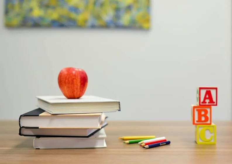 books stacked on a desk